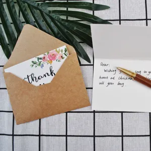 Vintage kraft paper greeting card set with floral thank you card and brown envelope.