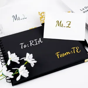 Detail of gold and silver handwritten letter stickers on DIY journals and gift cards