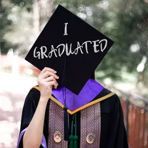 Detail view of gold 2018 stickers and white letter decals on a graduation outfit