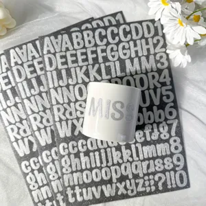 Silver glitter alphabet stickers applied to a white mug showing the texture and size detail
