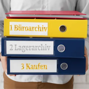 Detail showing 1-inch glitter gold alphanumeric stickers on colorful office binder files