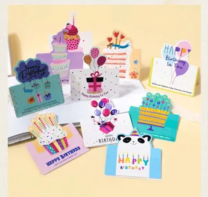 Close-up detail of various colorful 3D pop-up birthday cards with cute artistic designs