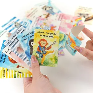 Close-up of SEL affirmation cards for kids showing flexible material and animal illustrations