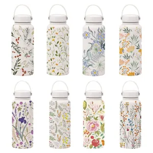 Eight variants of stainless steel insulated water bottles with elegant floral prints.
