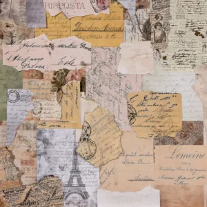 Detailed macro view of vintage scrapbooking paper with Eiffel Tower and old scripts