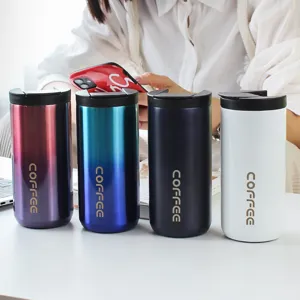 Set of four colorful 304 stainless steel coffee tumblers on a desk in a bright lifestyle setting