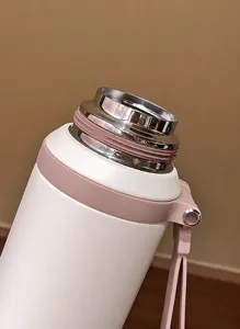 Detailed close-up of the smooth 316 stainless steel mouth of this insulated water bottle