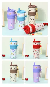 Detail view of various 316 stainless steel insulated tumblers with straws and straps