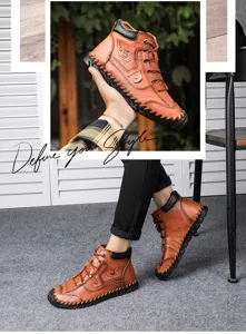 Detailed view of handmade leather men's work boots in vintage brown finish for outdoor style