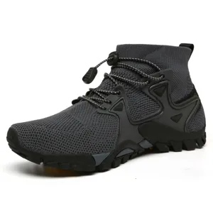 Vista laterale scarpe da trekking grigie in mesh con allacciatura rapida e suola
