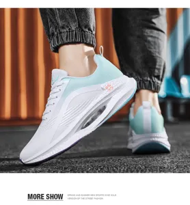 Close-up of white and light blue lightweight sports sneakers on feet for street fashion