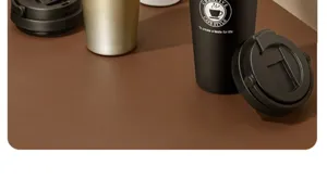 Stainless steel coffee travel mug detail, vacuum insulated portable cup lid and matte black body.