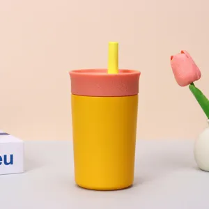 Dubbelwandige gele roestvrijstalen koffiebeker met rietje en koraalroze deksel variant