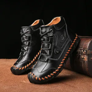 Retro handmade black leather men's work boots with orange stitching and mid-top design