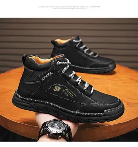 Close-up of black mid-top Martin boots with white stitching and laces