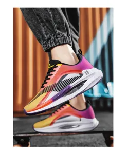Lightweight sports shoes with vibrant gradient design for men and women on skateboard