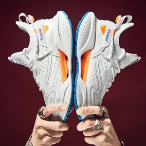 High-top white unisex sneakers with orange and blue accents and Tracer branding detail