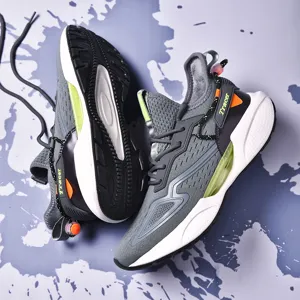 Versatile unisex grey outdoor running shoes featuring lime green and orange accents