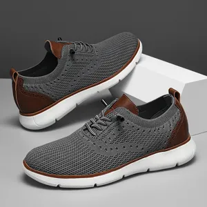 Breathable grey mesh men's casual sneakers featuring brown leather accents and white soles