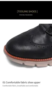 Detailansicht der schwarzen Herrenschuhe aus Leder mit Brogue-Muster und Textur