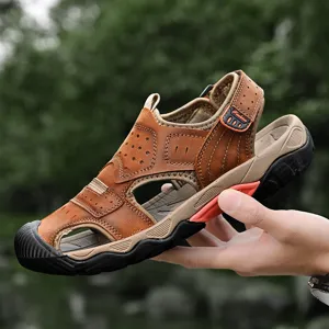 Close-up of brown leather men's outdoor sandal showing stitching and sole detail