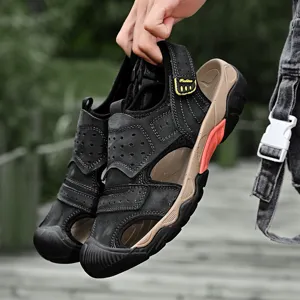 Detailed view of high-quality men's black leather outdoor sandals with rugged rubber sole.