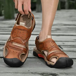Detail view of brown leather men's outdoor sandals with protective rubber toe cap.
