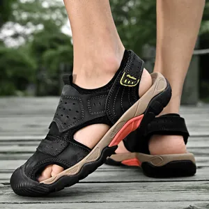 Close-up detail of men's genuine leather outdoor sandals worn on a wooden deck outdoors