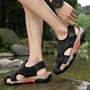 Close-up of men's leather outdoor sandals with rugged sole on a model near water
