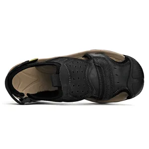 Detail view of men's black leather outdoor casual sandals with perforated strap design