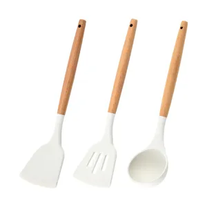 Minimalist 3-piece white silicone kitchen utensil set with natural wooden handles