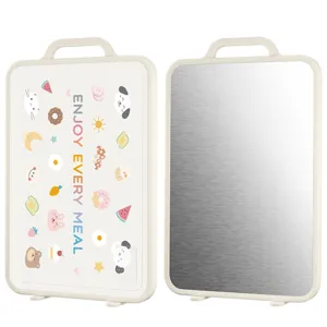 Double-sided cutting board showing patterned PP side and brushed stainless steel side