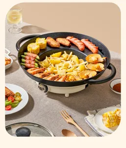 Close-up of a multi-functional electric grill pan with diverse grilled food on a dining table
