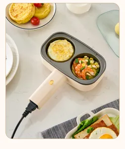 Detail of 2-hole electric egg burger pan with non-stick coating and breakfast food
