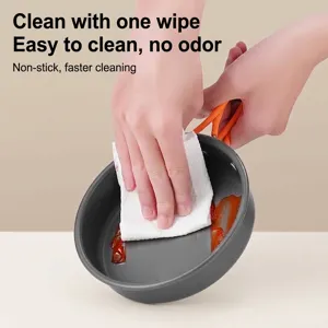 Portable non-stick camping frying pan with orange folding handle for outdoor cooking