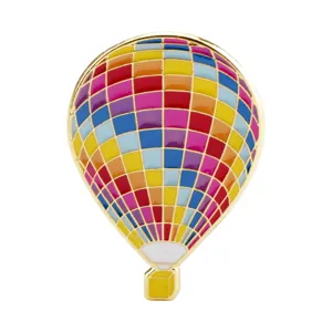 Detailed macro view of colorful enamel hot air balloon brooch badge with golden finish
