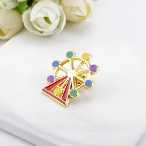 Detailed close-up of a colorful Ferris wheel enamel pin on a white surface