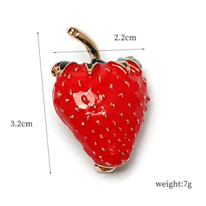 Red enamel strawberry brooch metal pin detail shot showing compact size and exquisite craft.