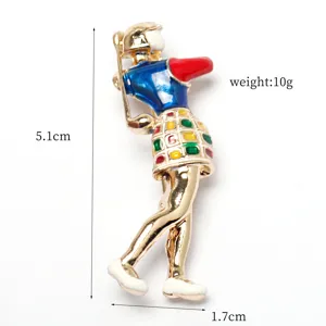 Detailed view of a gold alloy golf player brooch with colorful enamel skirt and dimensions.