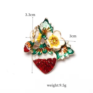 Enamel strawberry and flower brooch detail view, elegant decorative pin accessory.