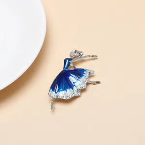 Detailed shot of exquisite blue enamel ballet dancer brooch with sparkling rhinestones.