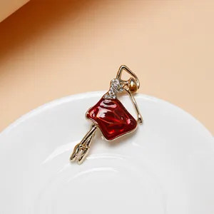 Elegant ballet girl brooch with red enamel and rhinestones for women fashion jewelry accessory.
