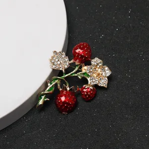 Close up of crystal strawberry flower brooch rhinestone fashion pin accessory detail view