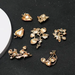 Gold tone fruit plant brooch back view detail showing secure metal pin clasp mechanism.