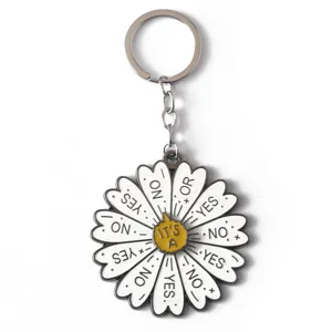 Detailed shot of the decision-making metal flower keychain with yes no rotating design.