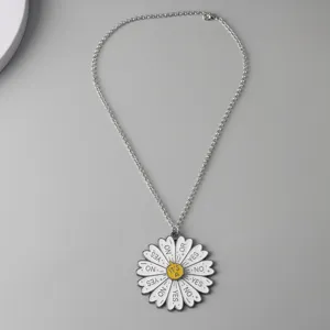 Detailed view of the fun indecision daisy pendant necklace alloy charm fashion accessory.
