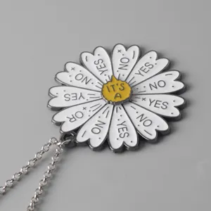 Detailed close-up view of the novelty indecision daisy flower spinning metal pendant necklace.
