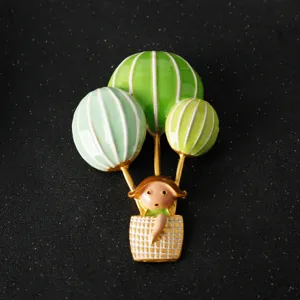 Green hot air balloon cartoon girl brooch pin, cute enamel lapel pin for suit bag decoration.