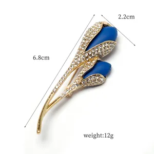 Elegant rhinestone tulip flower brooch pin with blue petals and gold stem for women fashion.