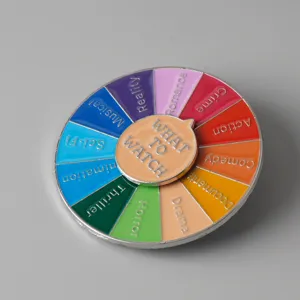 Novelty enamel movie genre spinner pin badge, fun rotating wheel metal brooch gift.
